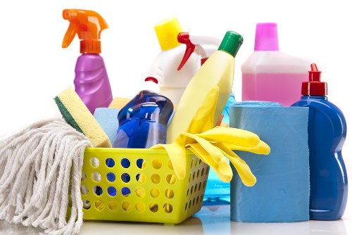 Professional cleaner using protective gloves and equipment