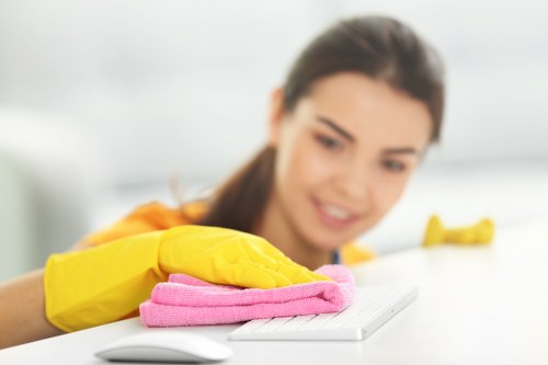 Technician handling cleaning chemicals with protective care